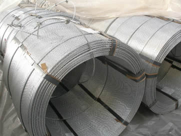 Several large coils of galvanized steel strands, each of them is tied up by six steel strips.